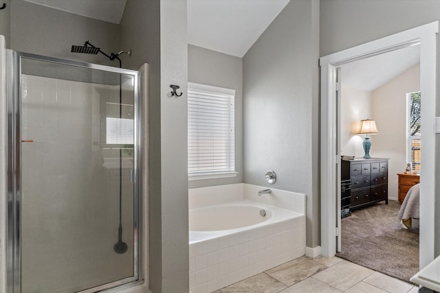 bathroom with tile patterned flooring, plus walk in shower, and a wealth of natural light