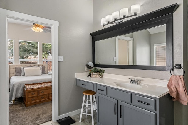 bathroom featuring ceiling fan and vanity