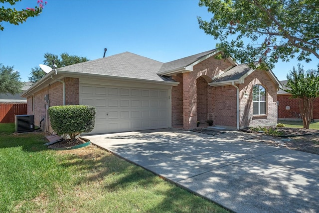 ranch-style home with central AC and a garage