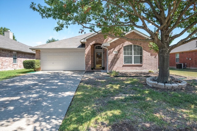 single story home with cooling unit, a garage, and a front lawn