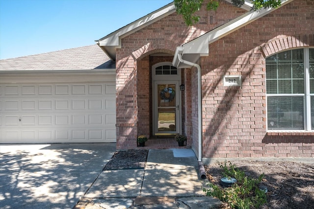 doorway to property featuring a garage