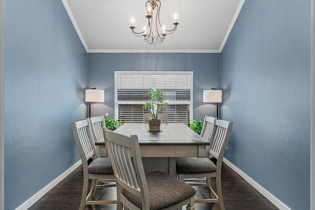 dining space with crown molding, dark hardwood / wood-style floors, and a chandelier