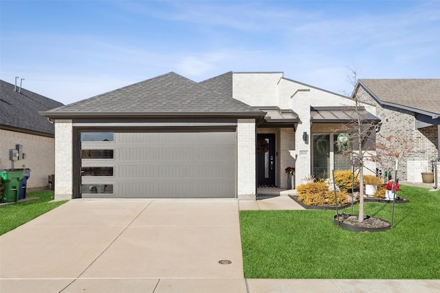 view of front facade featuring a garage and a front lawn