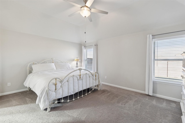 carpeted bedroom featuring lofted ceiling and ceiling fan