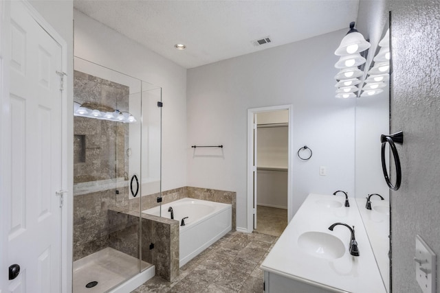 bathroom with shower with separate bathtub and vanity