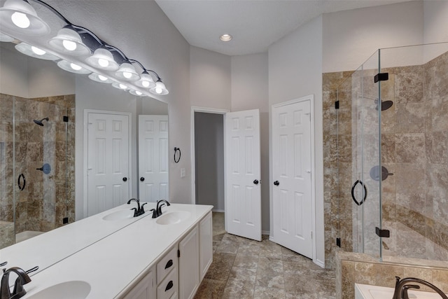 bathroom featuring vanity and separate shower and tub