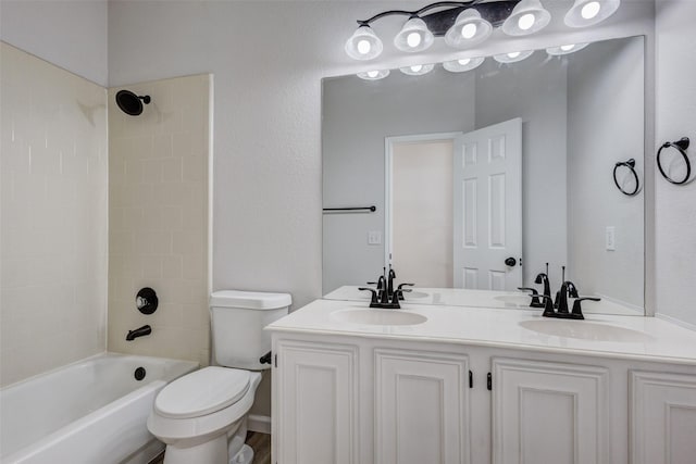 full bathroom with washtub / shower combination, vanity, and toilet