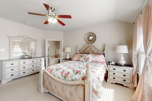 carpeted bedroom featuring ceiling fan and vaulted ceiling