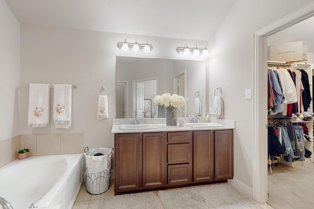 bathroom with vanity and a washtub