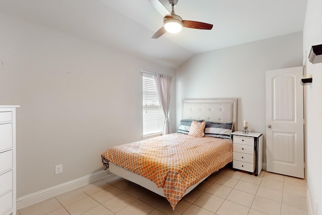 tiled bedroom with vaulted ceiling and ceiling fan