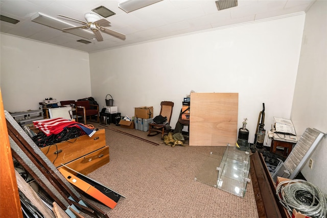 interior space with ceiling fan