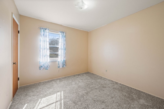 spare room featuring carpet flooring