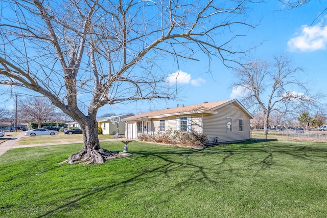 rear view of property with a yard