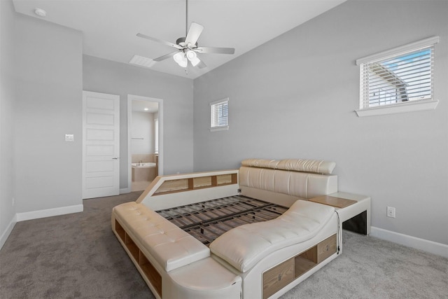 carpeted bedroom with lofted ceiling, ensuite bath, and ceiling fan