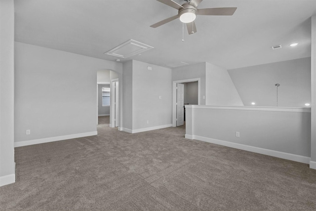 unfurnished living room featuring vaulted ceiling, carpet flooring, and ceiling fan