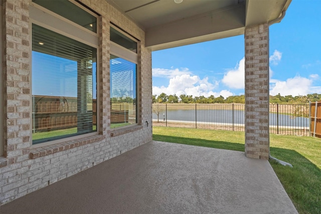 view of patio featuring a water view