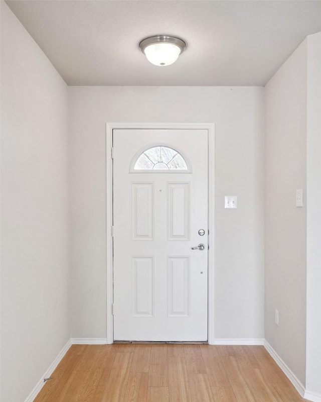 entryway with light hardwood / wood-style floors