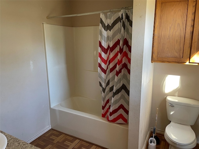 bathroom with shower / bath combo, parquet flooring, and toilet