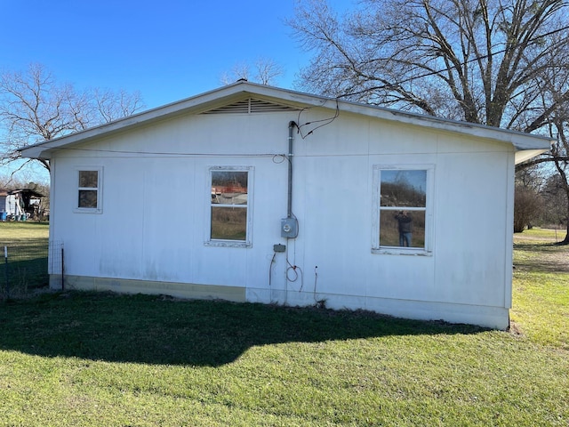 view of property exterior featuring a yard