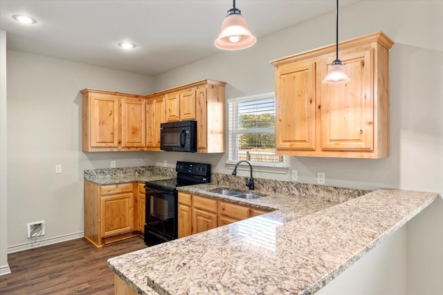 kitchen featuring pendant lighting, sink, black appliances, dark wood-type flooring, and light brown cabinets