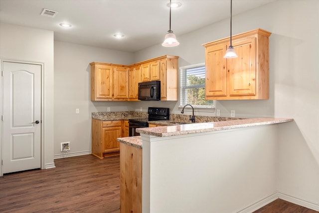 kitchen featuring pendant lighting, sink, black appliances, light stone countertops, and kitchen peninsula