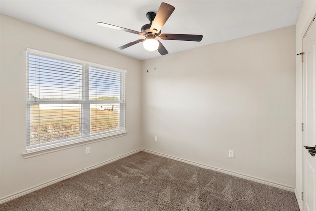 carpeted empty room with ceiling fan