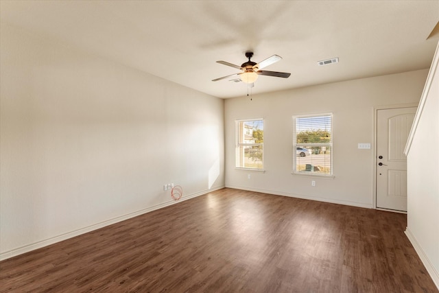 unfurnished room with dark hardwood / wood-style floors and ceiling fan