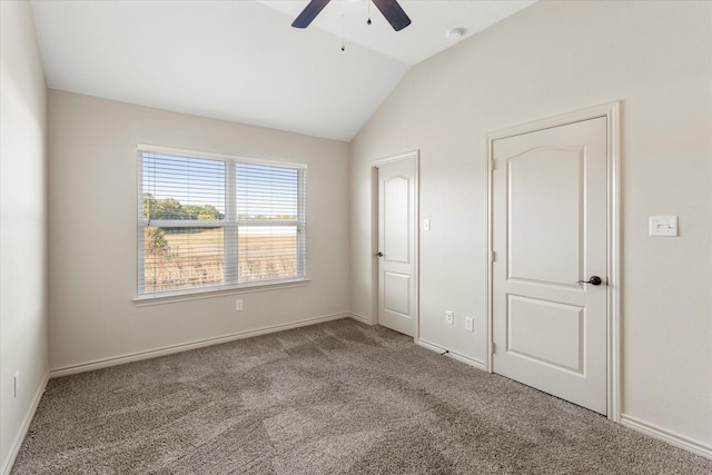 unfurnished bedroom featuring lofted ceiling, ceiling fan, and carpet flooring