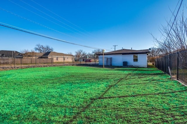 view of yard featuring central air condition unit