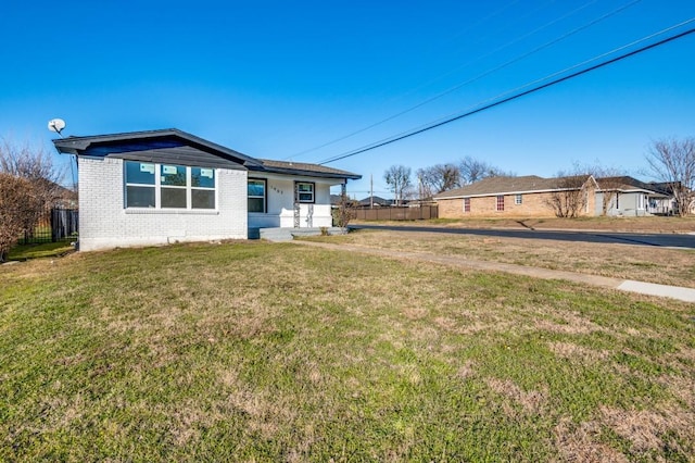 view of front of property with a front lawn