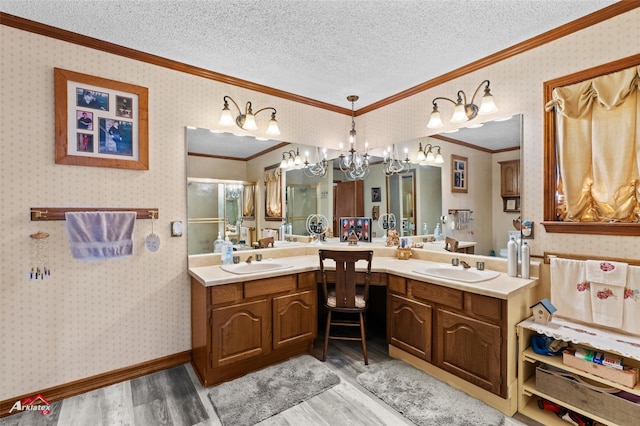 bathroom with vanity, hardwood / wood-style floors, and crown molding