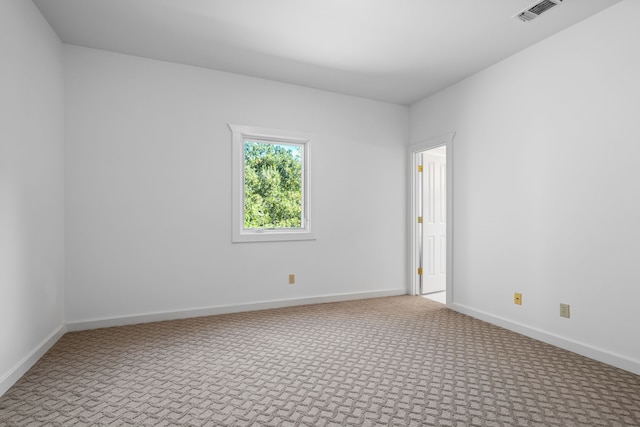 spare room featuring carpet flooring