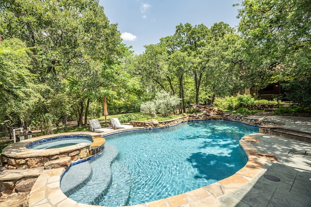 view of pool featuring an in ground hot tub and a patio area