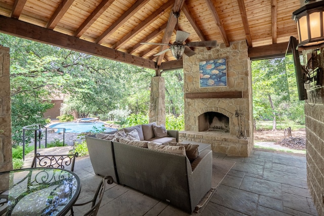 view of patio / terrace featuring an outdoor living space with a fireplace