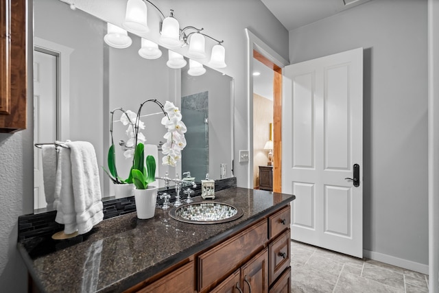 bathroom with tile patterned floors and vanity