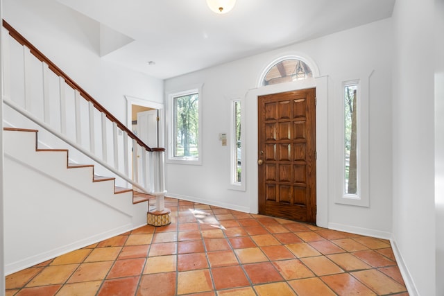 entryway with light tile patterned floors