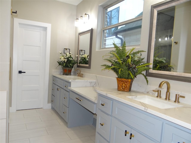 bathroom featuring tile patterned flooring and vanity