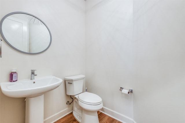 bathroom featuring toilet and hardwood / wood-style floors