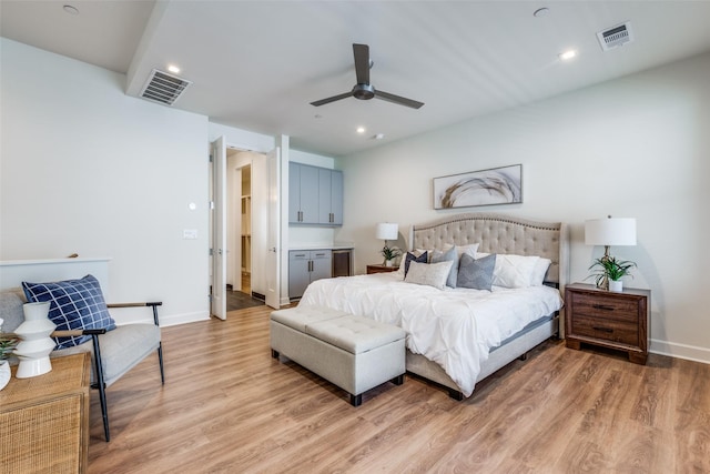 bedroom with light wood-type flooring and ceiling fan