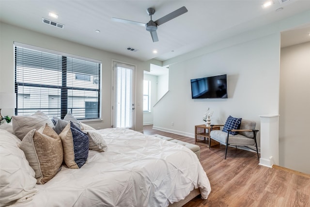 bedroom featuring hardwood / wood-style floors and ceiling fan