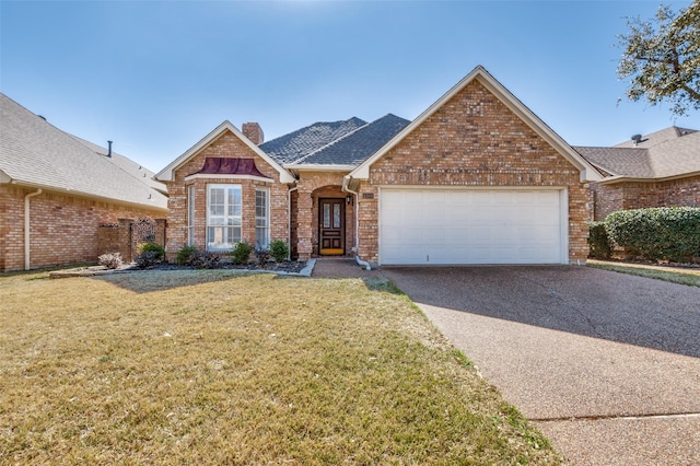 view of front of home featuring a garage and a front lawn