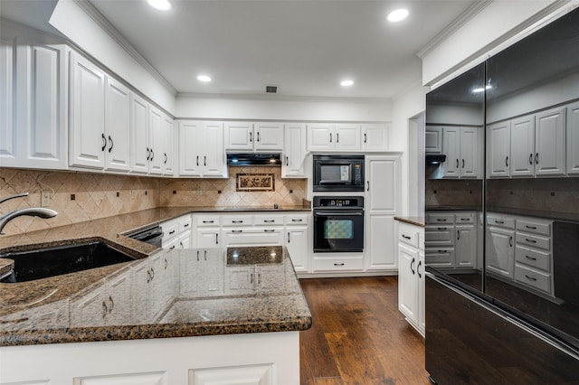 kitchen featuring white cabinets, sink, and black appliances