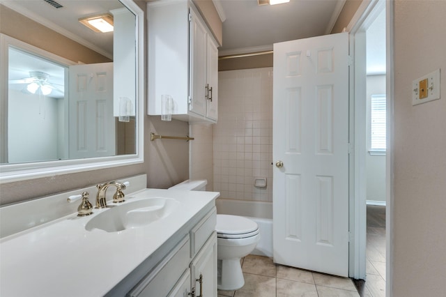 full bathroom with tile patterned flooring, vanity, ceiling fan, toilet, and crown molding