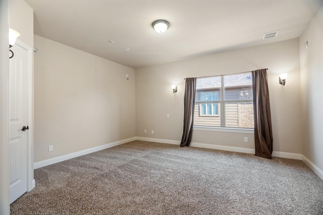 spare room featuring carpet floors