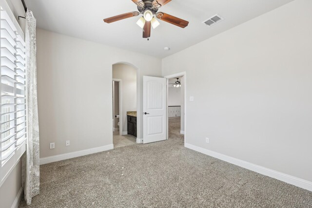 carpeted empty room with ceiling fan