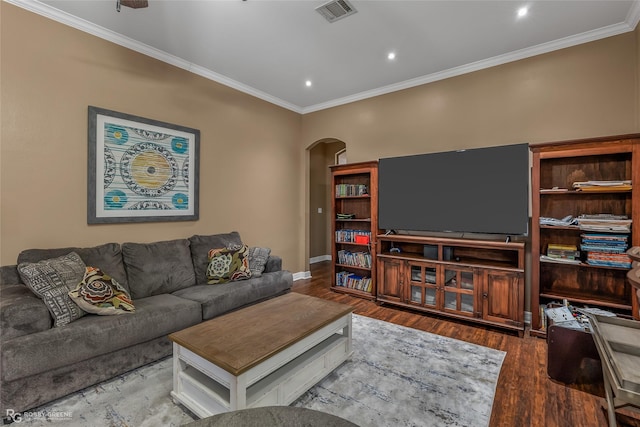 living room featuring wood-type flooring and ornamental molding