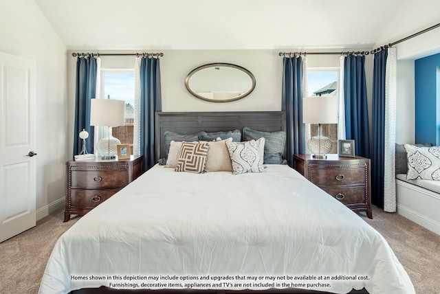 carpeted bedroom with vaulted ceiling