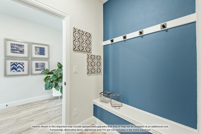 mudroom with light hardwood / wood-style flooring