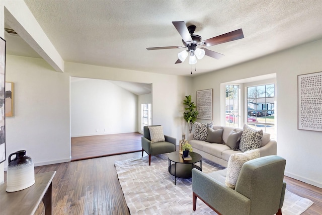2842 Carlson Dr, Dallas, TX 75235 - living room with ceiling fan, hardwood / wood-style flooring, and a textured ceiling