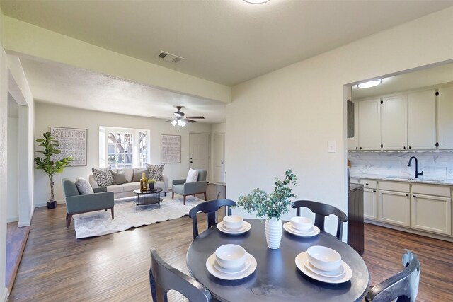 2842 Carlson Dr, Dallas, TX 75235 - dining space with ceiling fan, sink, and dark hardwood / wood-style floors